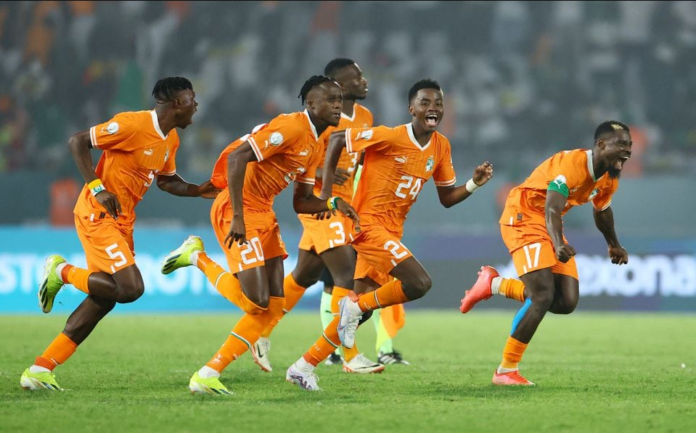 Elephants of Cote d' Ivoire players celebrate victory over Senegal