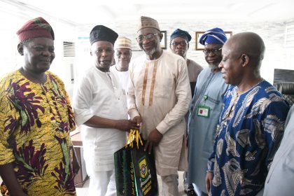 Yabatech rector, Ibraheem Abdul presenting college souvenir to Lateef Fagbemi, AGF and former Yabatech board chair and others