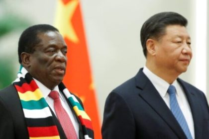 Zimbabwe official with Zhou Ding