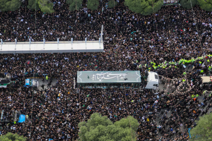 Mourners attend a burial ceremony of the late Iran's President Ebrahim Raisi in Mashhad