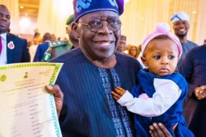 Tinubu and a child