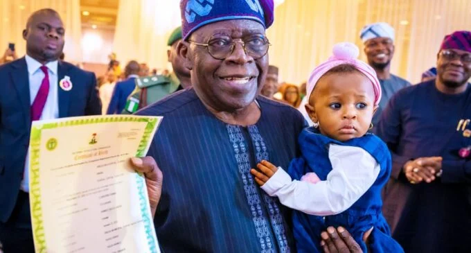 Tinubu and a child