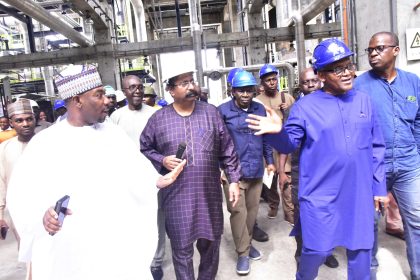 Aliko Dangote and others during a tour of Dangote refinery plant in Lagos