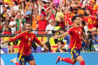 Mikel Merino and Ferran Torres celebrate the winning goal against Germany i