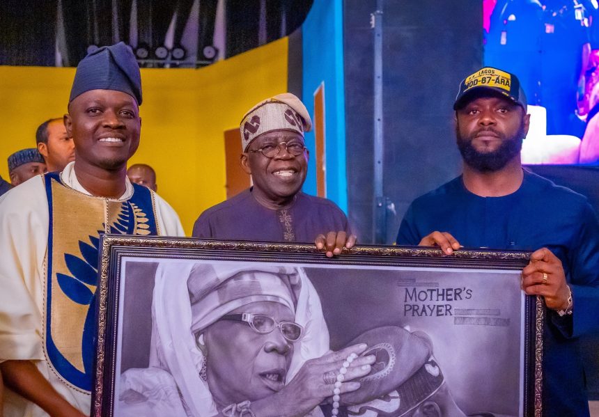 Tinubu, Seyi and other holding late Abibatu Mogaji's portrait