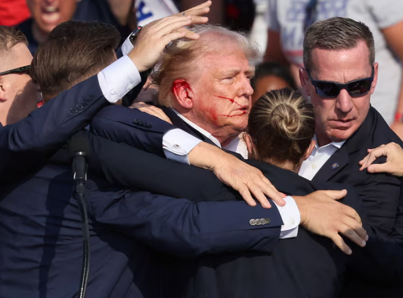 Trump rescued by security aides after the gun attack