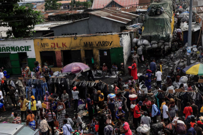 People shop at a public market in Kinshasa, the Democratic Republic of Congo