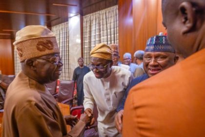 Abdulkabir Aliu(m) greets President Tinubu while Rabiu Abdsamad looks on