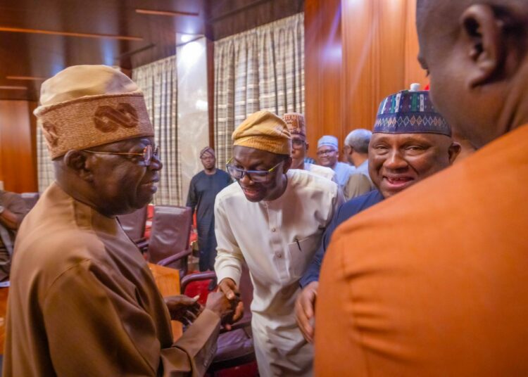 Abdulkabir Aliu(m) greets President Tinubu while Rabiu Abdsamad looks on