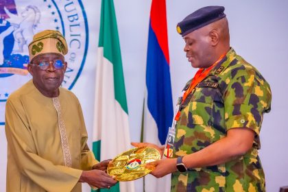 President Tinubu with Rear Admiral Olumuyiwa Olotu, Commandant, NDC