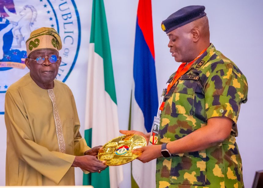 President Tinubu with Rear Admiral Olumuyiwa Olotu, Commandant, NDC