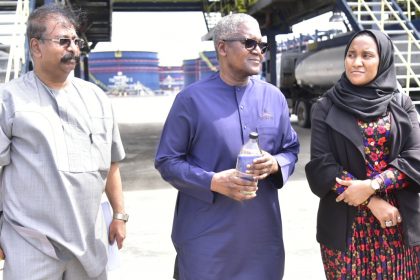 Devakumar Edwin, Aliko Dangote and Fatima Aliko Dangote during the unveiling of the first output of PMS