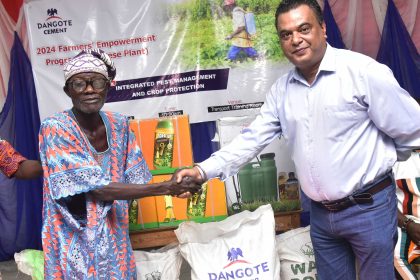 Elder Simon Oyewole, farmer beneficiaries and Roy Uttam, Plant Director, Dangote Cement Plc Ibese plant