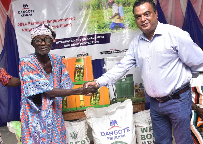 Elder Simon Oyewole, farmer beneficiaries and Roy Uttam, Plant Director, Dangote Cement Plc Ibese plant