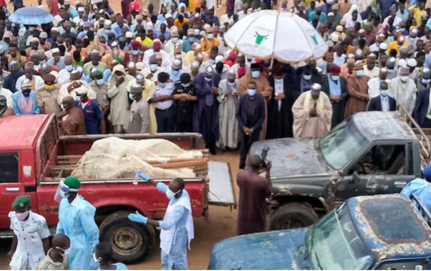 Trucks carry the wrapped bodies of people killed by suspected Boko Haram militant