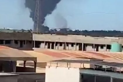 Smoke rises from the international airport that was attacked by insurgents in Bamako