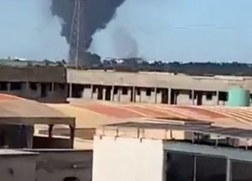 Smoke rises from the international airport that was attacked by insurgents in Bamako