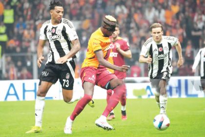 Galatasaray’s Victor Osimhen (right) vying with Besiktas’ Cher Ndour (left) during their Turkish Super League match