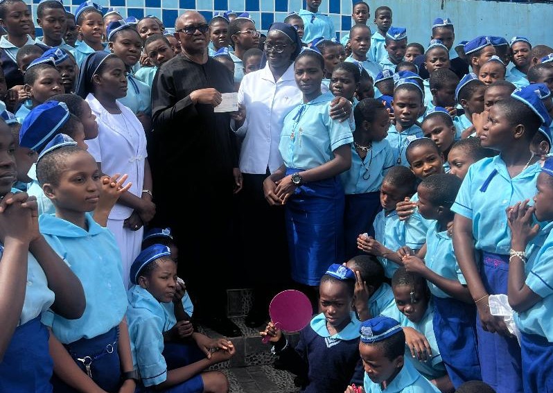 Obi presenting the cheque to Holy Rosary Sisters’ students