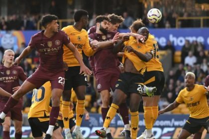 John Stones heads in Manchester City's late winner at Wolves