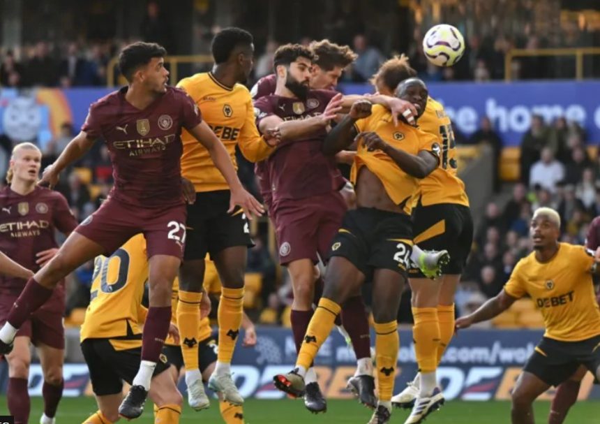 John Stones heads in Manchester City's late winner at Wolves