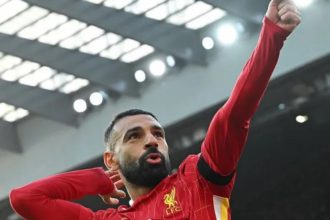 Mohamed Salah celebrates putting Liverpool ahead from the penalty spot against Chelsea at Anfield