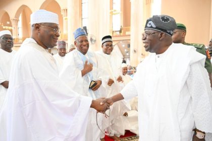 Atiku shakes hands with Tinubu