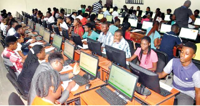 Candidates sit for UTME exam