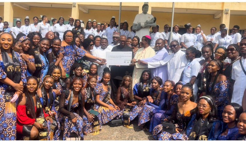 Obi presenting a cheque of 50 million Naira for continued infrastructural improvements at Peter University, Onneh/Achina